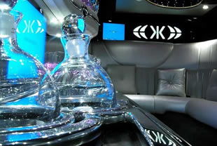 Decanters and mood lighting inside limousine